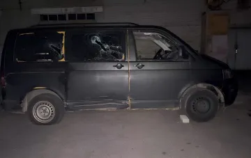 Damaged service vehicle after a crowd attacked TCC soldiers and police in Lutsk: broken windows and a damaged body