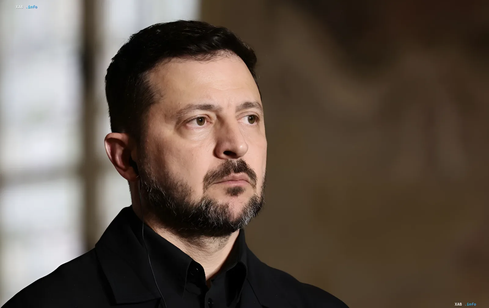 Volodymyr Zelenskyy in a black shirt discussing peace initiatives with the UN