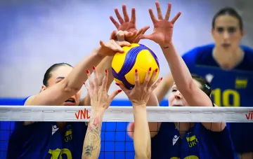 Ukrainian volleyball players blocking at the net during the Euro 2026 match against Bulgaria