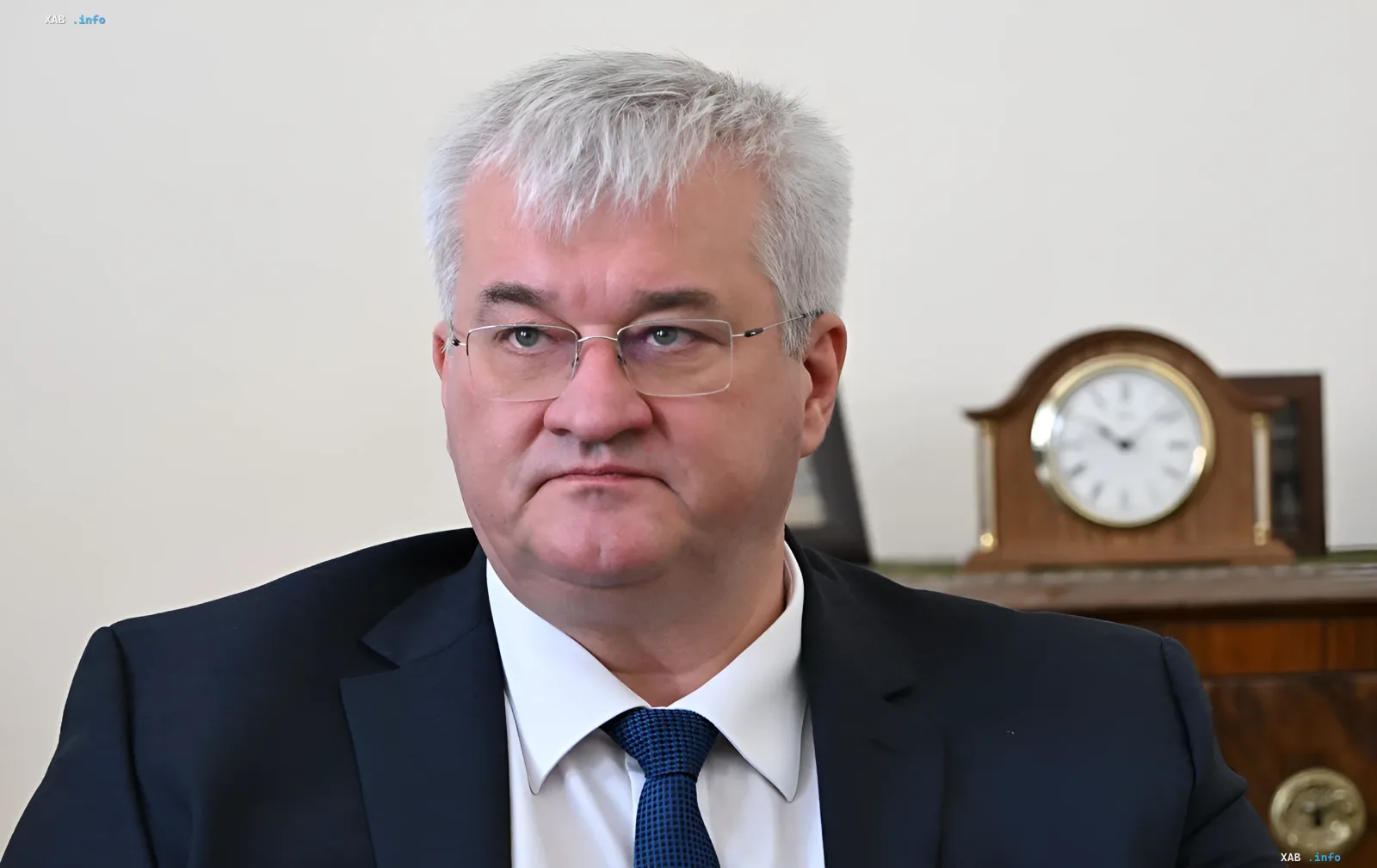 Portrait of Sibiga in a business suit against an office background with a clock — statement on accelerating the Freyja project after meeting the German Foreign Minister