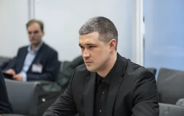Fedorov in a black suit at a hearing, calling on Zelensky to publicly answer about corruption in his close circle