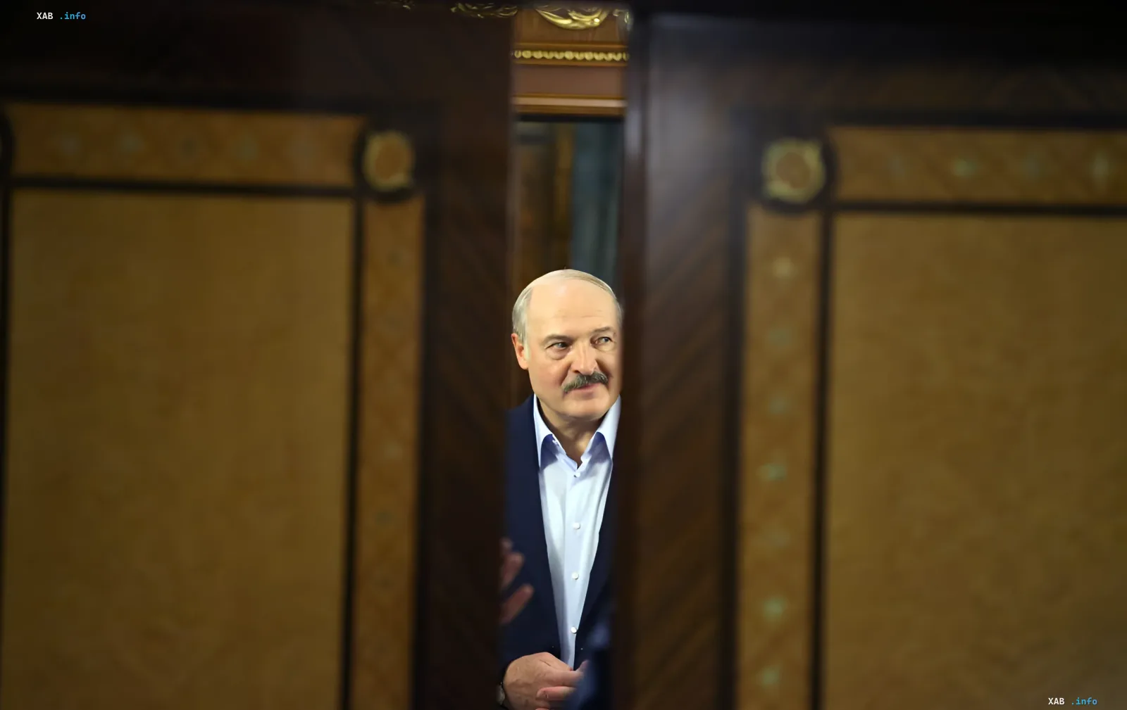 Alexander Lukashenko standing in a doorway during an official meeting related to the changing US-Belarus diplomatic relations