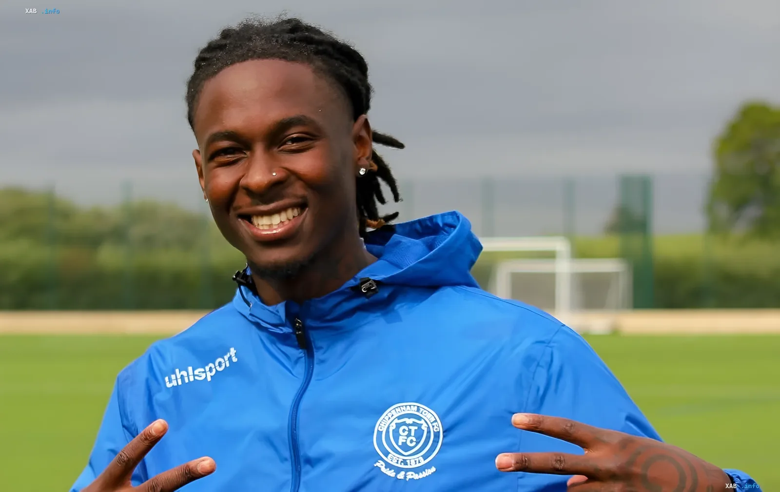 Portrait of 25-year-old midfielder Kevin Castro in a blue training jacket on a football pitch before a friendly match