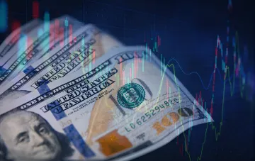 Dollar exchange rate in September: price charts over dollar bills illustrate pressure on the hryvnia