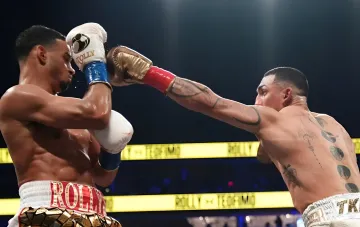 Teofimo Lopez lands a punch on Shane Porter in the WBA welterweight title fight