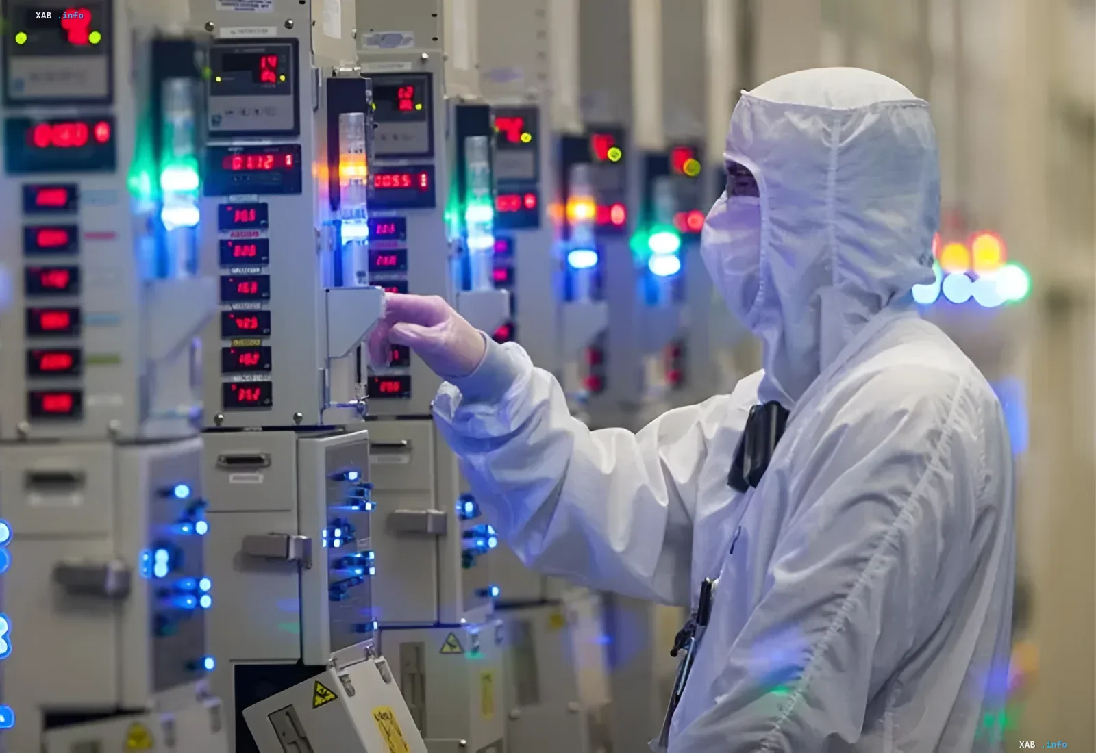 Micron engineer in a cleanroom operating semiconductor equipment for next-generation AI memory production