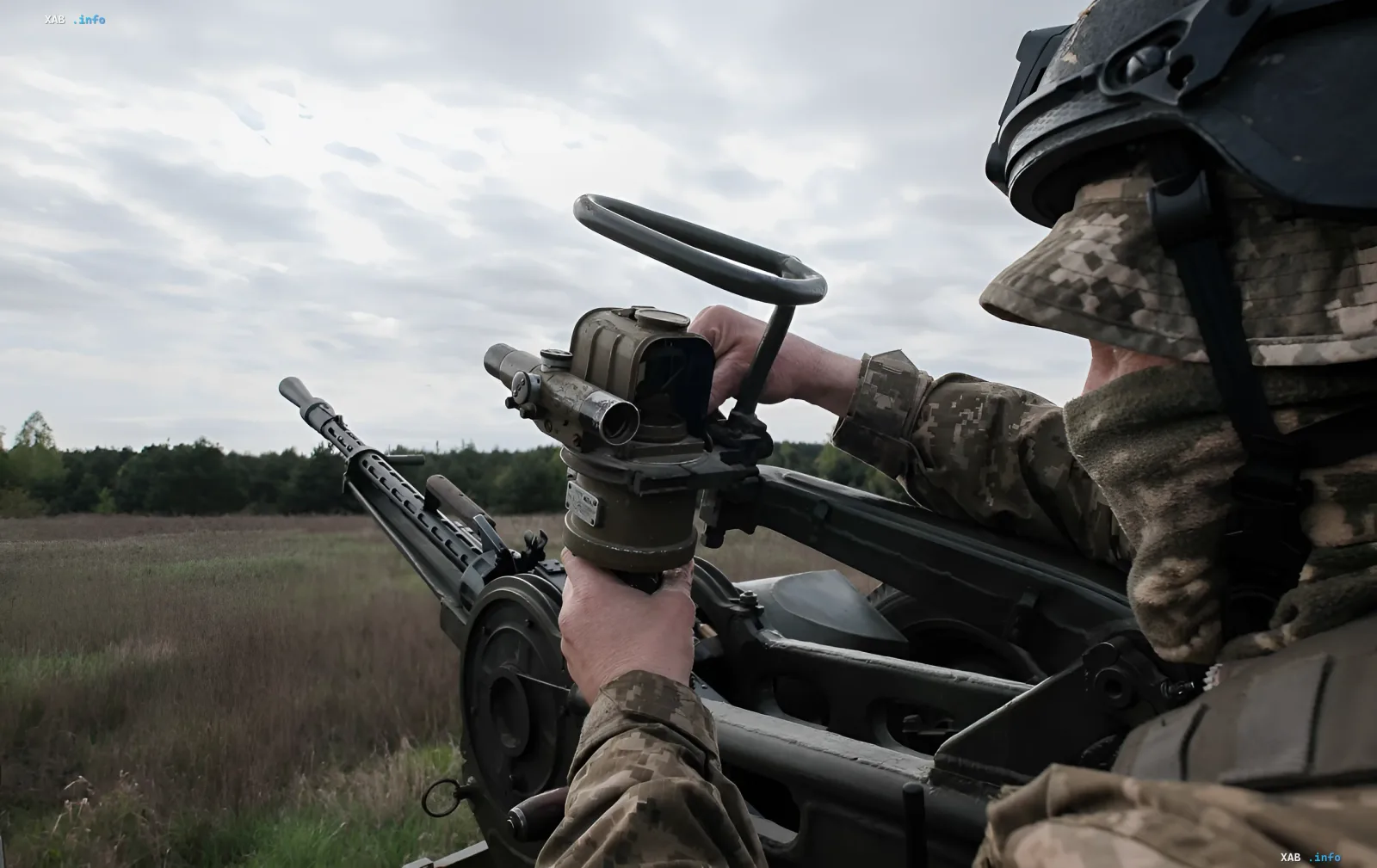 Ukrainian soldier operating an anti-aircraft gun on an open field in Odesa region during a massive Russian attack