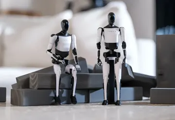 Tesla Optimus Humanoid-Roboter auf einer Produktionsfläche — Tesla rüstet das Fremont-Werk für deren Fertigung um