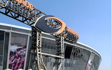 Shattered glass on the facade of Donbass Arena in Donetsk after 12 years of occupation