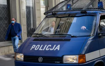 Polish police Volkswagen van marked POLICJA at the scene of the attack on Ukrainians in Radom