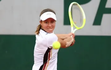 Veronika Podrez in action on court: hitting the ball in a US Open-2026 qualifying match