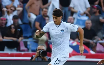 Mussolini's great-grandson in a white Lazio kit with number 15 celebrates on the pitch during his debut at the historic stadium