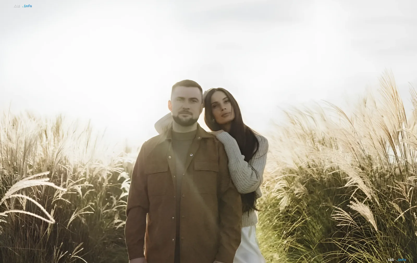 YARMAK and his partner in a family portrait against a field of tall grass — the rapper-warrior becomes a father for the second time