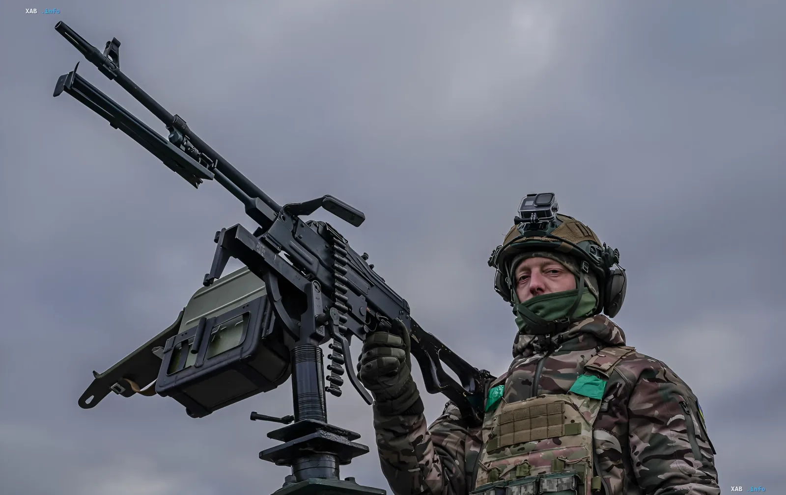 Air defense soldier manning an anti-aircraft machine gun during a nighttime drone attack