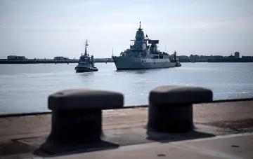 Swedish warship at Muskoe naval base, where a Russian national's plot is being expropriated over drone threats