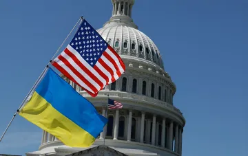 Ukraine and US flags against the Capitol dome — a symbol of diplomatic dialogue between the two nations