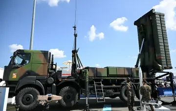 SAMP/T air defense missile system on a wheeled chassis with raised launcher at a military exhibition — the air defense system Italy and France are preparing for Ukraine