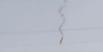 Trail of a jet-powered drone in the sky over Dynamo Stadium in Kyiv