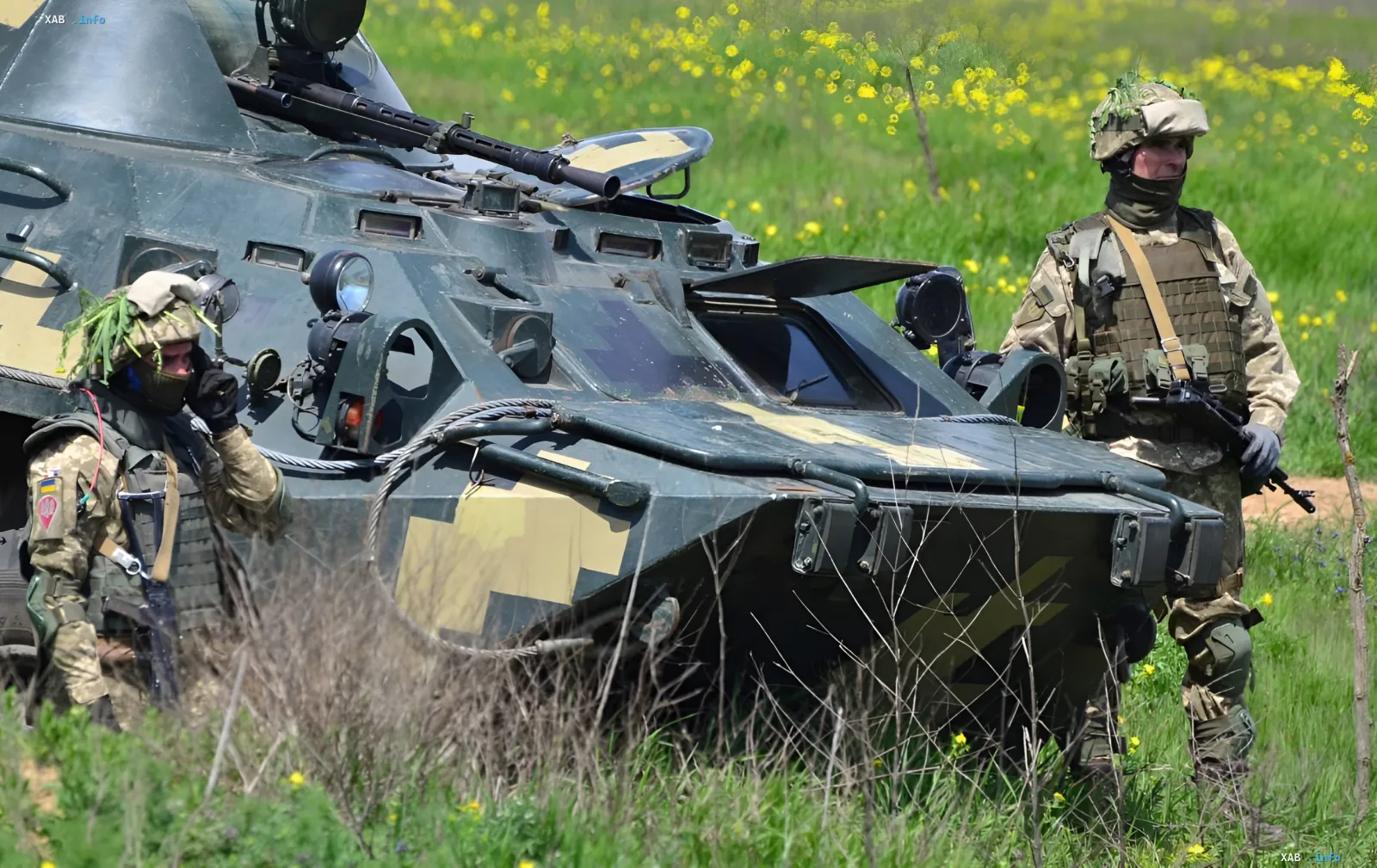 Ukrainian soldiers next to an armored vehicle during offensive operations in Kharkiv, Donetsk and Zaporizhzhia regions