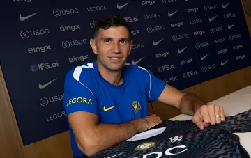 Emiliano Martinez in a Chelsea kit at the official contract signing ceremony