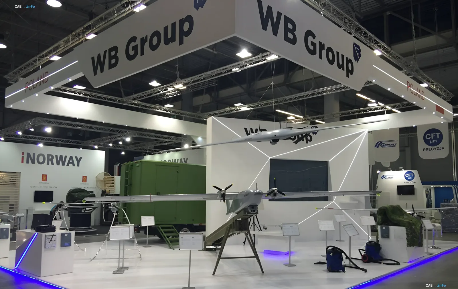 Exhibition stand of Polish company WB Electronics featuring unmanned aerial vehicles at a defense trade show