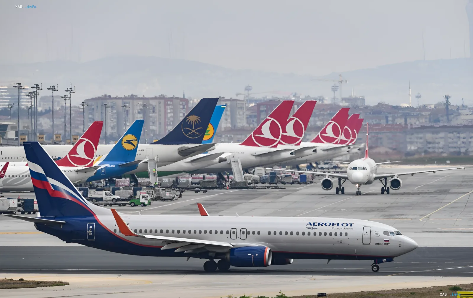 An Aeroflot jet on the runway of an international airport in front of foreign carriers' fleet — the airline's shares fell after Zelensky's 'closed sky' statement over Russia