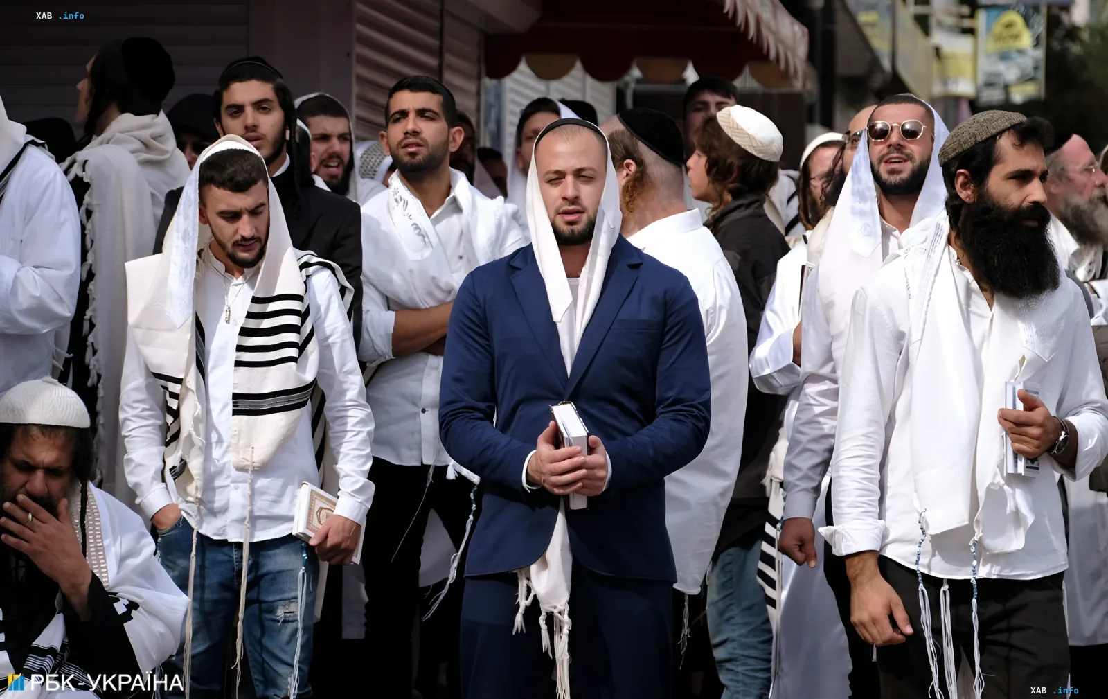 Jewish pilgrims in prayer shawls pray in Uman during Rosh Hashanah amid US State Department warnings about military risks