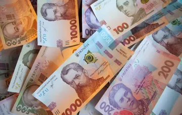 Ukrainian banknotes of various denominations: 500, 1000 and 200 hryvnia with portraits of cultural figures — illustration for the debate on introducing a 5000 hryvnia note