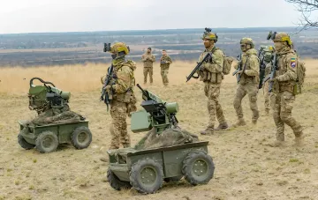 Soldiers of the 7th Corps DShV conducting a tactical operation with unmanned platforms and ATGM systems in an open field