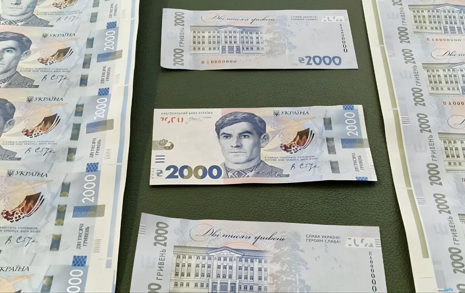Ukrainian 2000 hryvnia banknotes in circulation: new denomination notes with a portrait and a building shown on a table