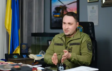 Kyrylo Budanov in SBU uniform at his desk revealing details of direct talks with Prigozhin and Kostyukov