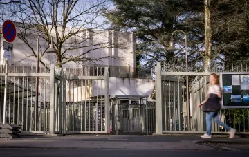 Russian consulate building in Bonn with high fence and barbed wire, where up to 20 SVR, FSB and GRU agents may have worked under diplomatic cover, per Bild