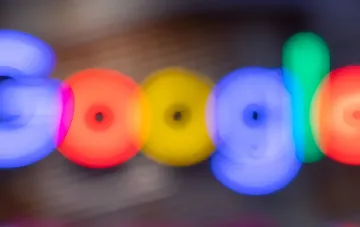 Vibrant colorful rings in Google's brand style — visualization of the September Android Drop update with Gemini in Find Hub