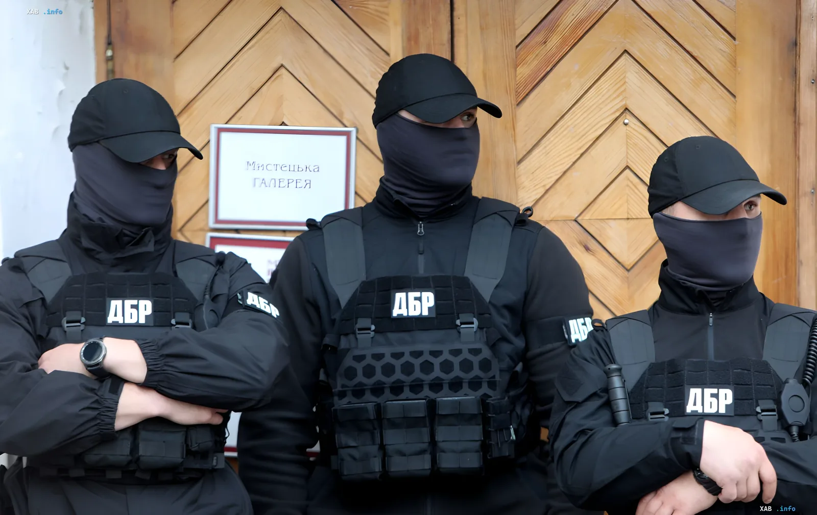 DBR (Detective Bureau of Investigations) officers in masks and tactical vests marked DBR in front of a wooden facade — investigation into the CEC sergeant incident in Pryluky