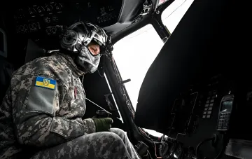 Pilot of a Ukrainian military helicopter in the cockpit amid talks on an air silence during the US envoys' visit to Kyiv