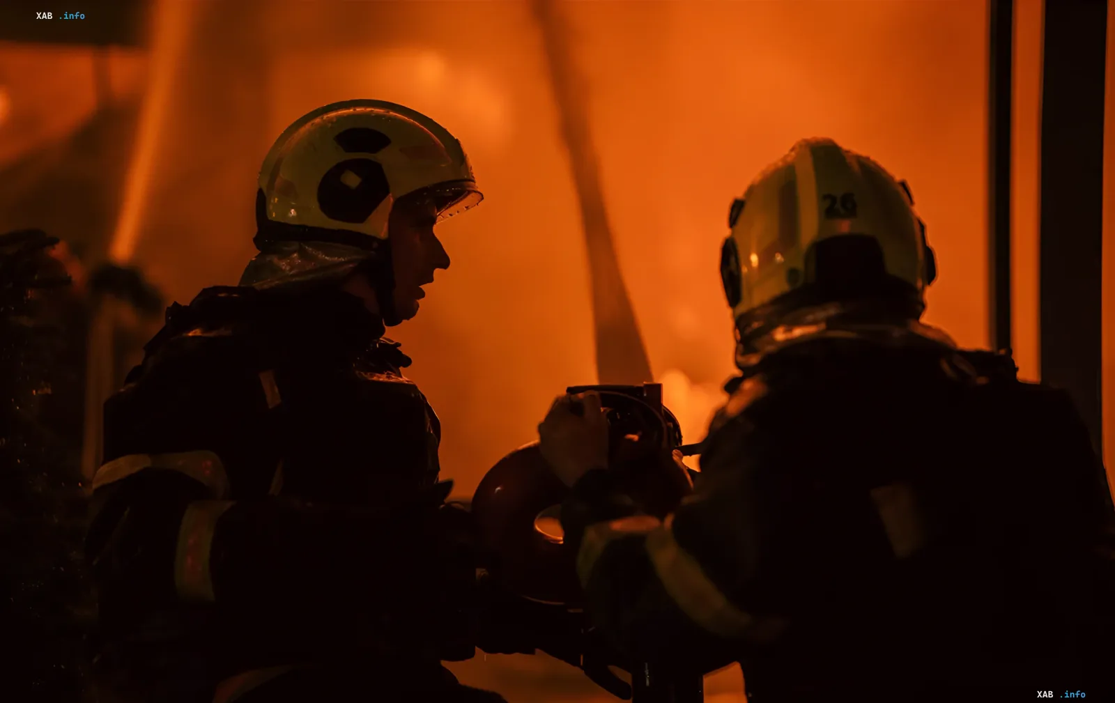 Firefighters work to contain a blaze at a logistics warehouse hit in the attack on Dnipro