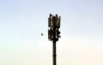 Mobile base station tower with 4G antennas against the sky after 3G service was phased out in Ukraine