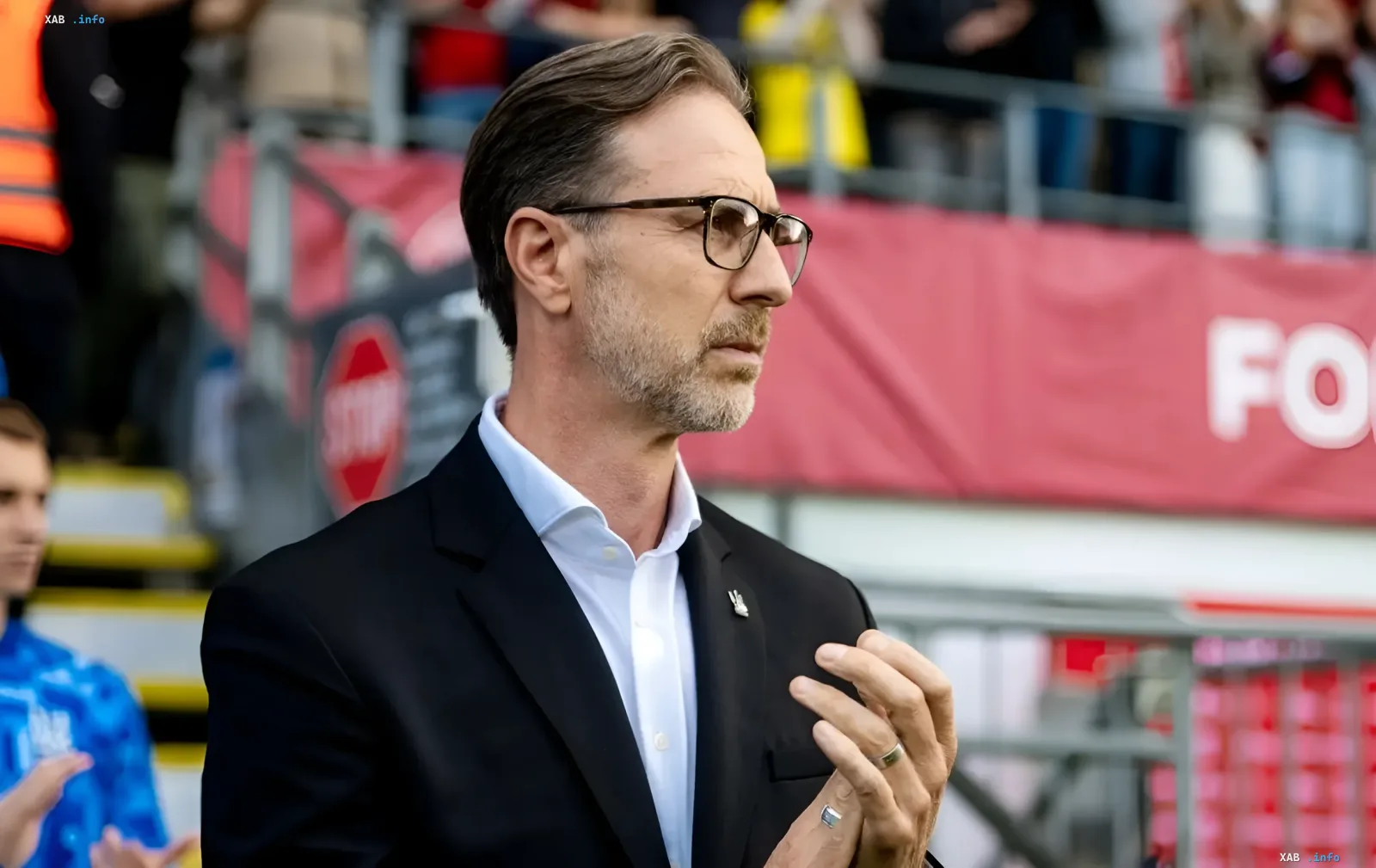 Andrea Moldera on the stadium stands ahead of a Ukraine national team Nations League match, urging fans to support the squad