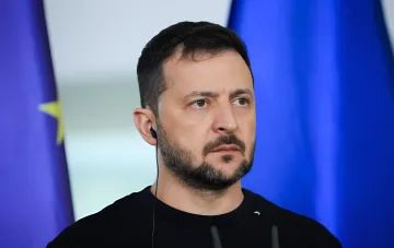 Volodymyr Zelensky against the Ukrainian flag ahead of the dismissal of Prosecutor General Kravchenko