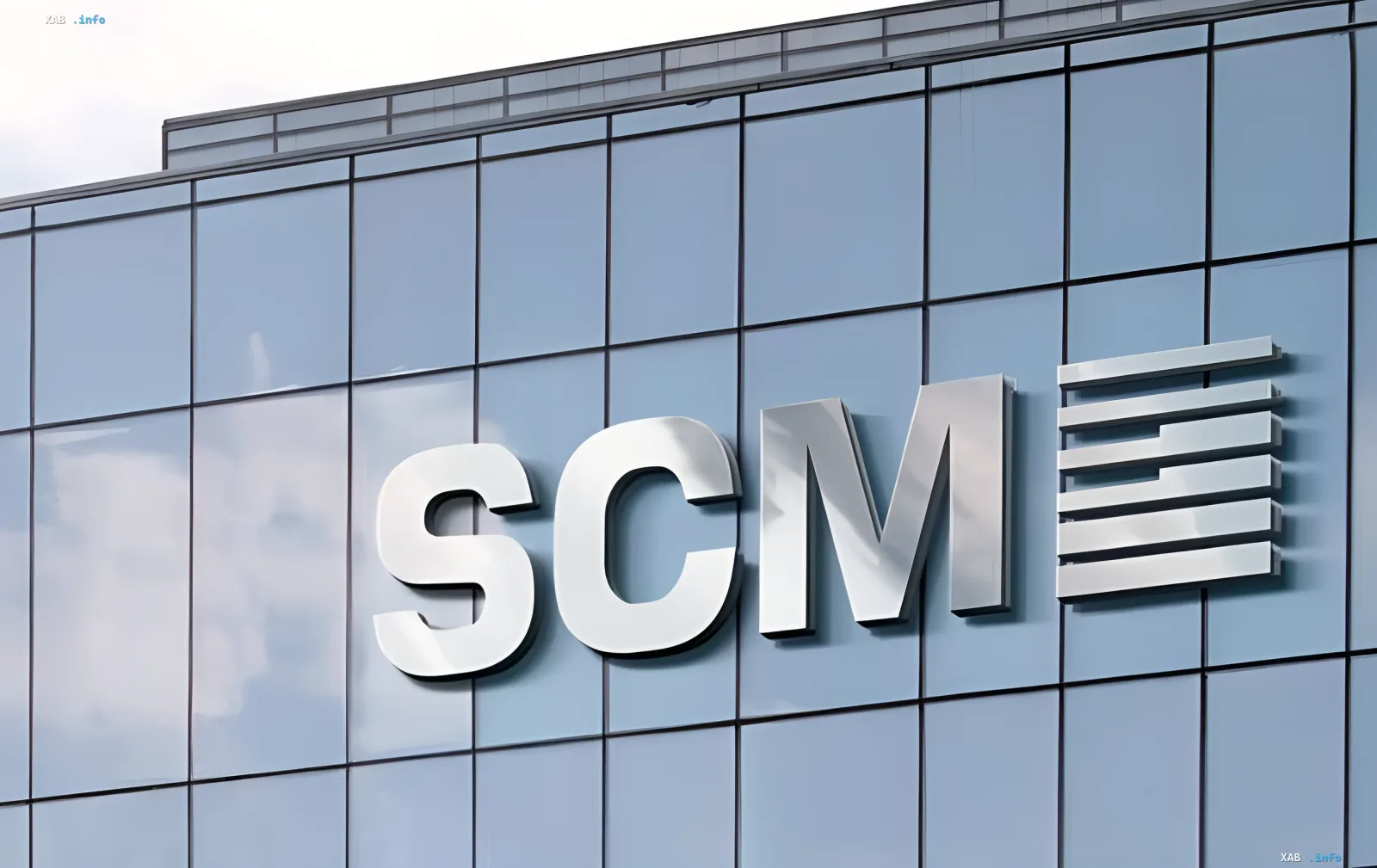SCM logo on the glass facade of an office building — Rinat Akhmetov's company invested $4.3 billion in Ukraine