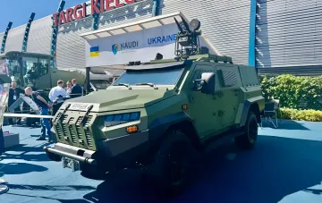 Ukrainian armored vehicle with an automatic anti-drone module on its roof at the MSPO 2026 exhibition