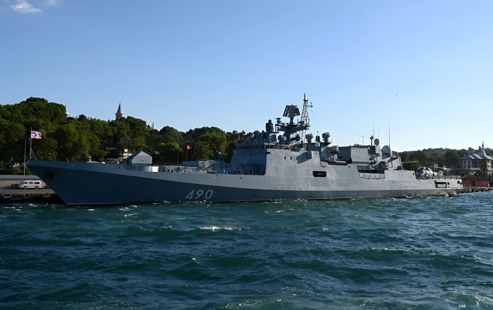 Warship with hull number 490 in a harbor waters against a backdrop of hills and buildings — illustration for the news on the Ukrainian strike on ships in Novorossiysk