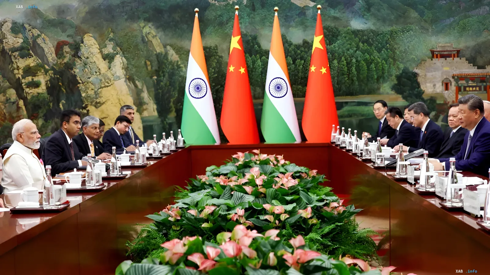 India and China delegations meeting at the BRICS summit in New Delhi: PM Modi and President Xi Jinping at the negotiation table under both nations' flags