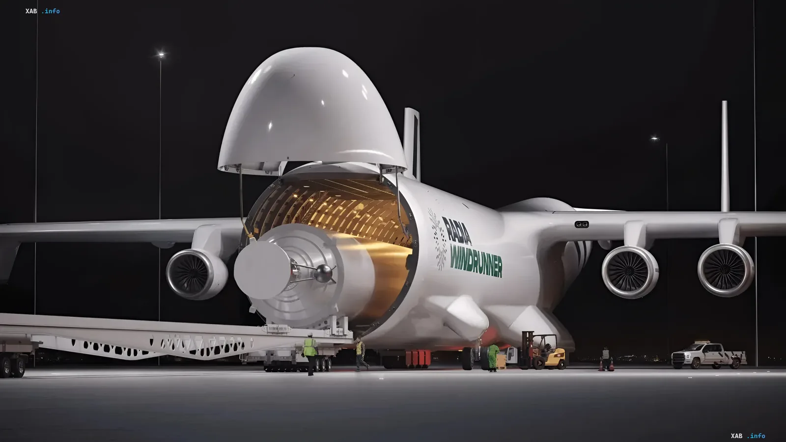 Radia WindRunner Frachtflugzeug mit geöffnetem Rumpf und montierter Raketenstufe auf einem nächtlichen Flugfeld