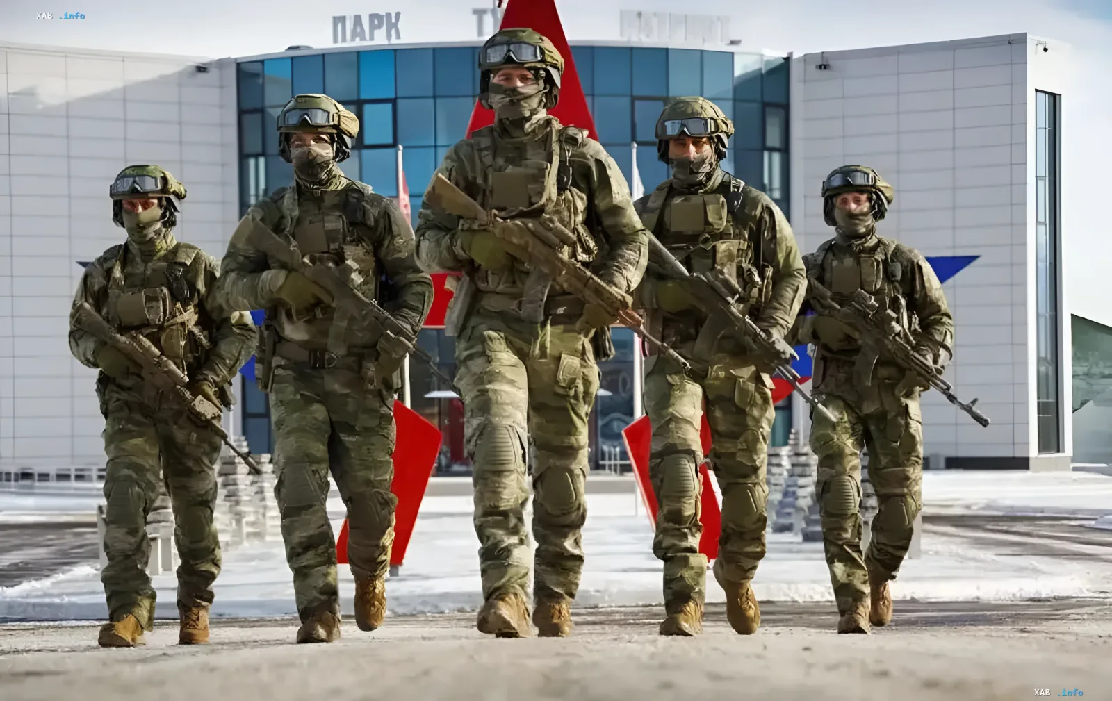 Five camouflaged soldiers with rifles march in formation — illustration for the story on a Russian intelligence network indicted by the US for plotting assassinations