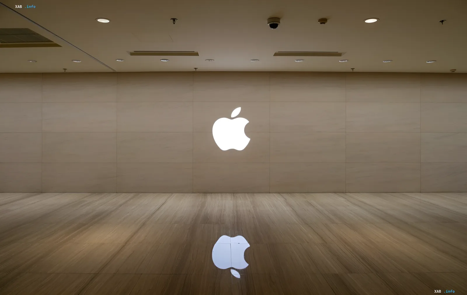 Светящийся логотип Apple на минималистичной стене — символ возвращения компании к серверным ИИ-машинам на чипах M8 Ultra и NVLink Fusion от Nvidia