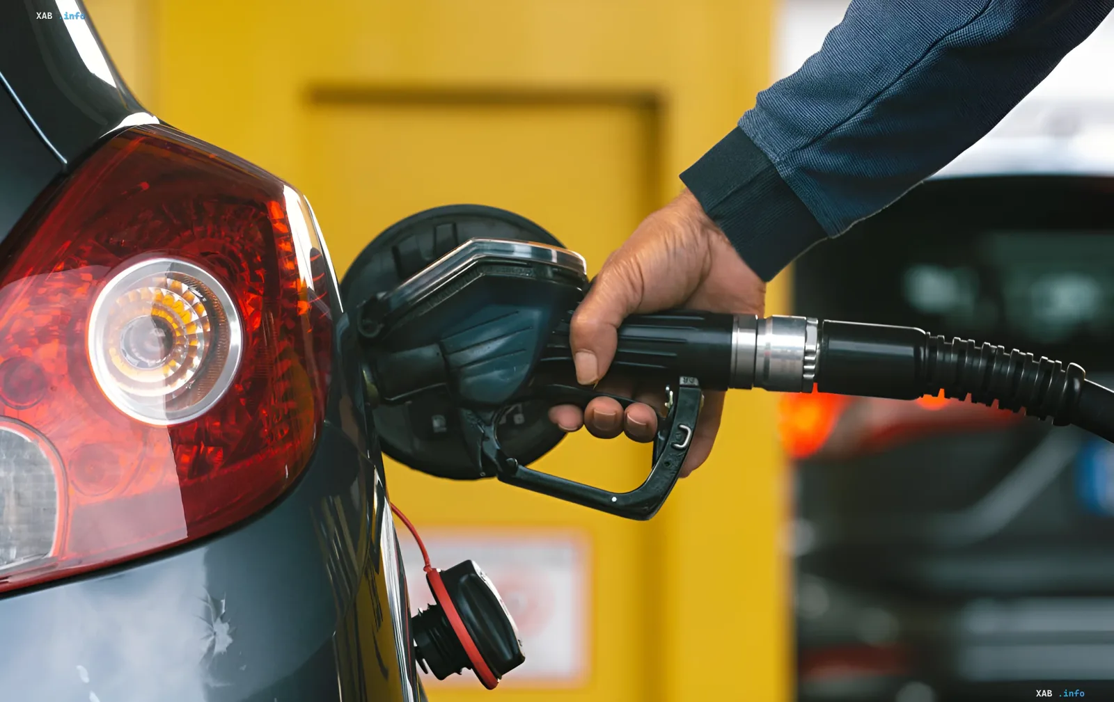 Refueling a car with diesel fuel at a Ukrainian gas station amid rising prices approaching 100 hryvnia