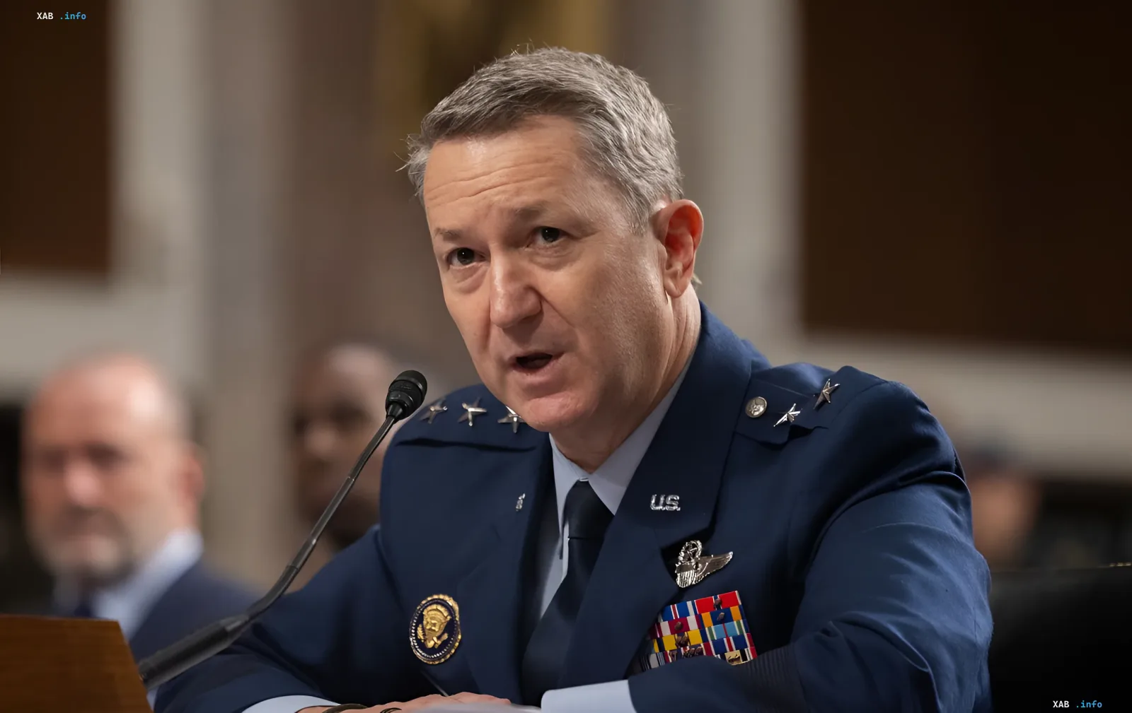 US general in dress uniform speaking into a microphone, commenting on the effectiveness of Ukrainian AI-powered drones against Russian conscripts