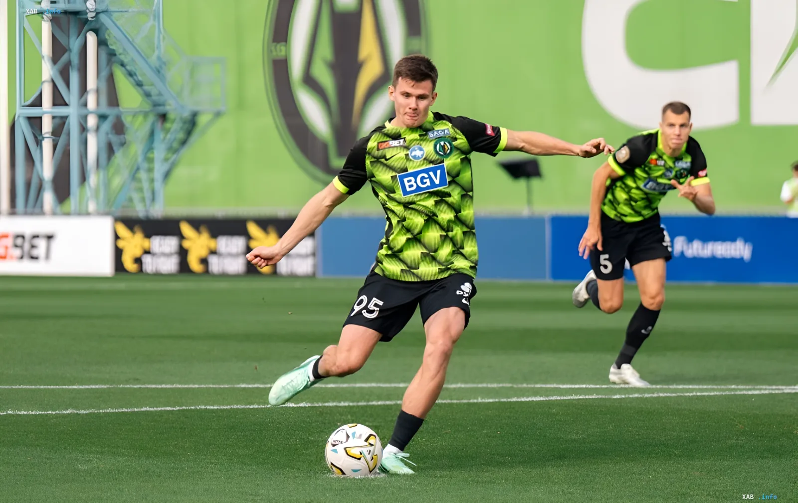 Polesia player wearing number 95 controlling the ball during the UPL match against Kryvbas