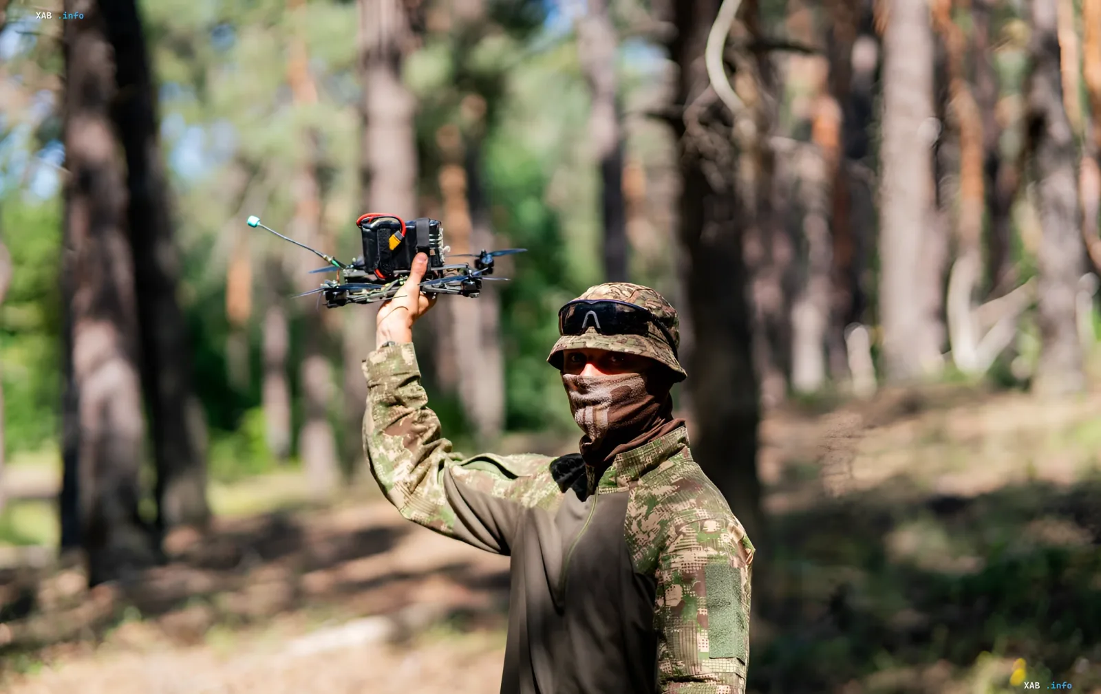 Operator of the 422nd LUFTWAFFE regiment holding a tactical drone in a forest during Operation Black Bird targeting the enemy power supply on the southern axis